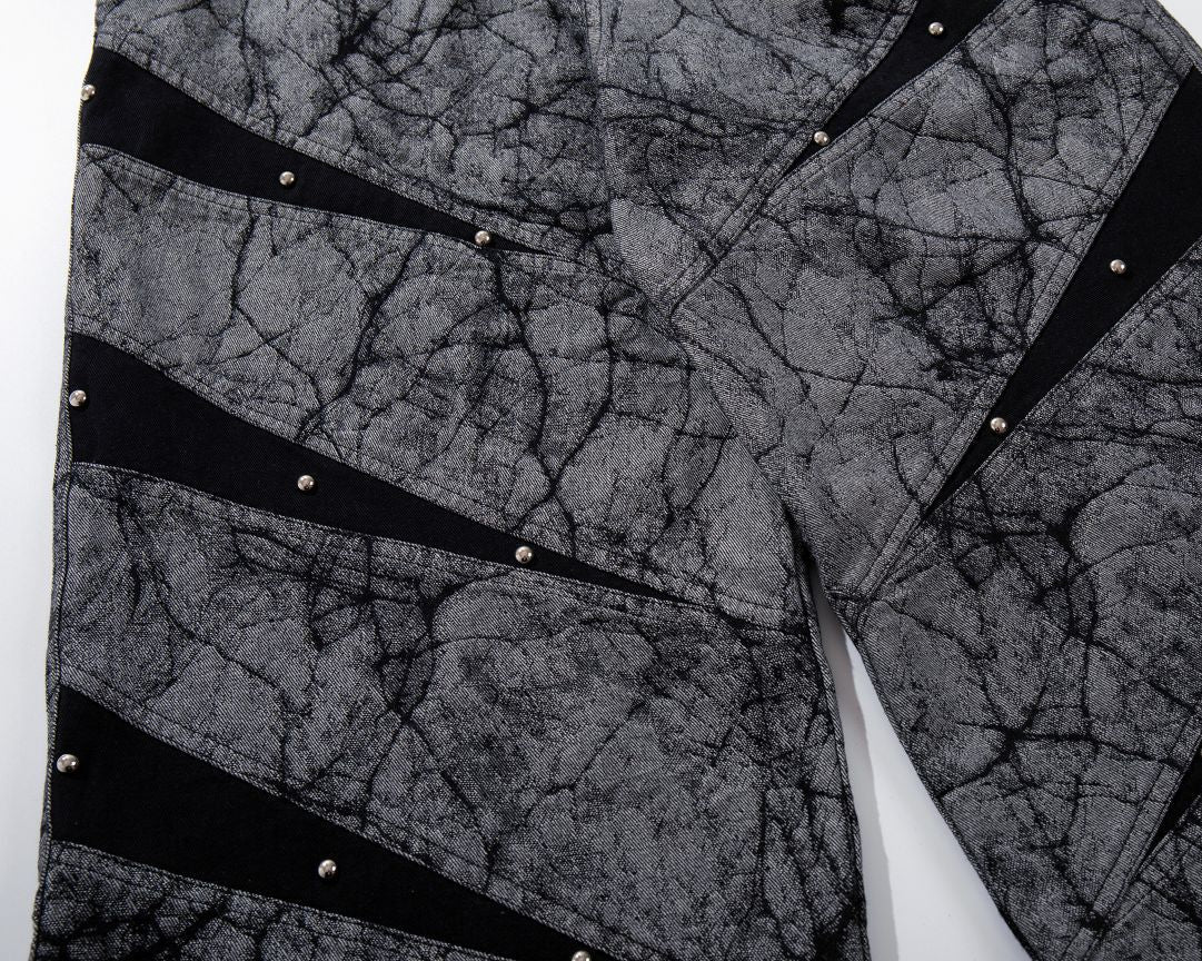 Close-up of a textured fabric with black geometric patterns on a white background