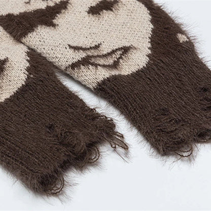 Pair of brown and beige knitted sweater sleeves on a light background