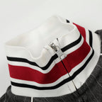 Close-up of a striped sweater with a zipper on a plain background