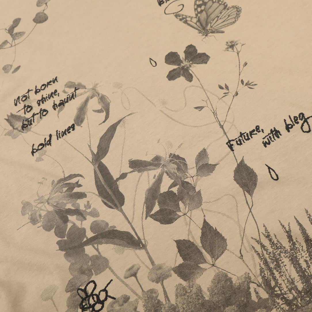 Beige fabric with black botanical illustrations and text