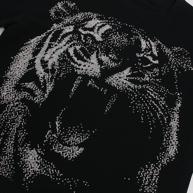 Black t-shirt with a tiger design made of small stones on a white background
