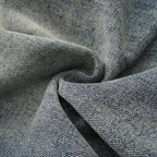 Close-up of textured denim fabric with folds
