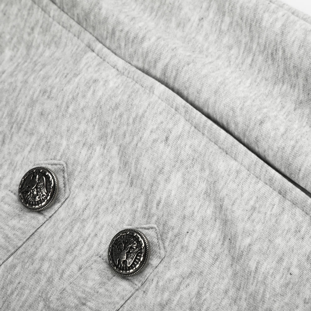 Close-up of a light heather gray fabric garment with two dark decorative buttons on the chest.