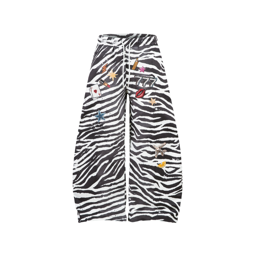Zebra print pants with colorful patches on a white background from honeybear