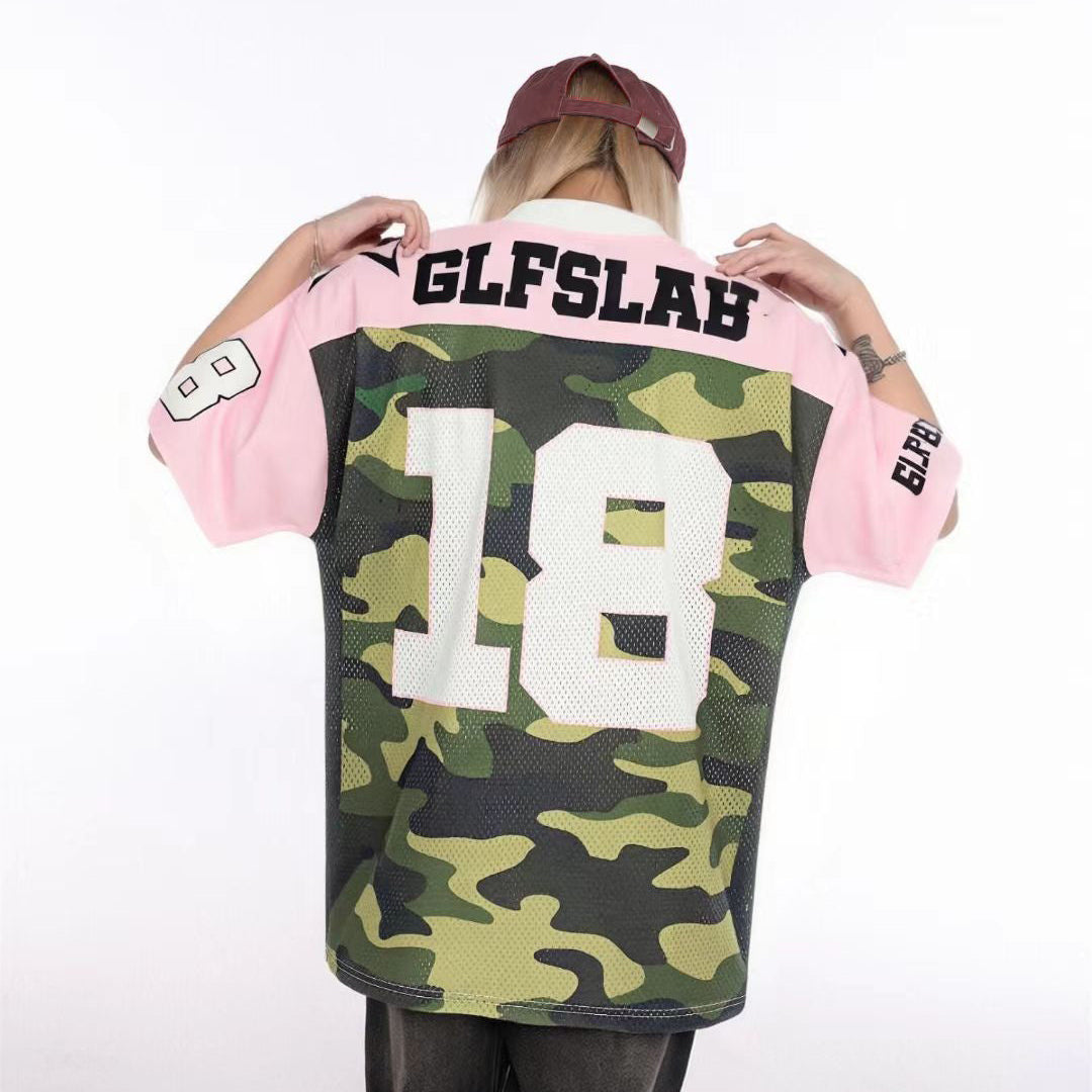 Person wearing a camouflage sports jersey with pink sleeves and 'GLFSLAB' branding.