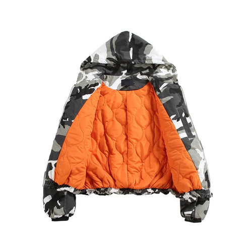 Camouflage-patterned jacket with orange interior on a white background