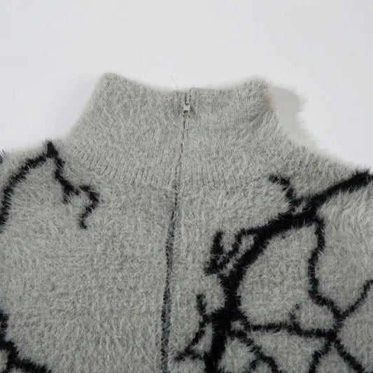 Gray fleece jacket with black abstract pattern on a white background