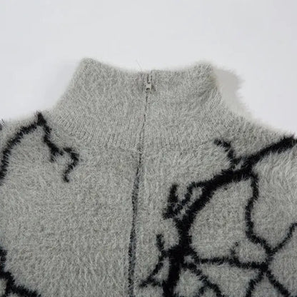 Gray fleece jacket with black abstract pattern on a white background