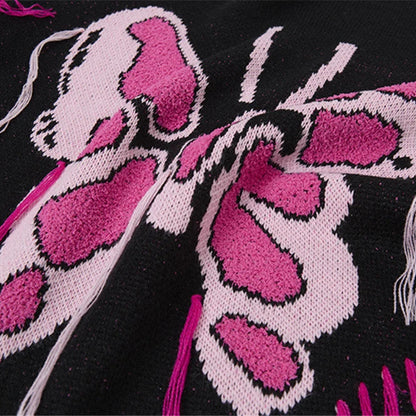 Close-up of a pink butterfly design on a black background