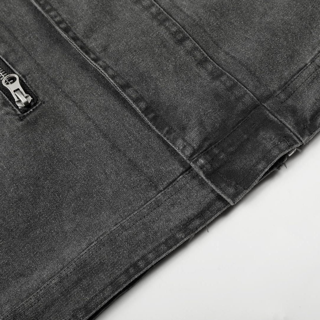 Close-up of a gray jacket with a zipper on a light gray background