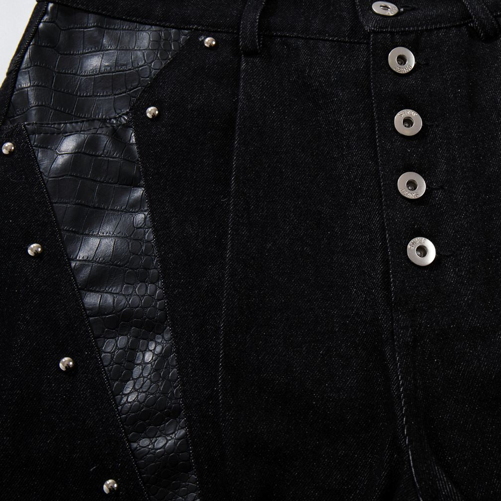 Close-up of a black Venom Stitch Panel Jeans with button details