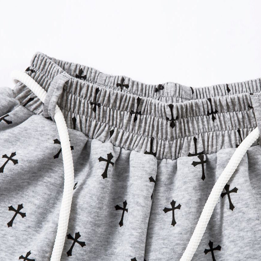 Gray pants with black cross patterns on a white background