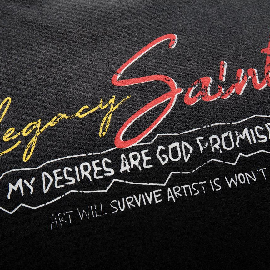 Black shirt with 'Legacy Saints' text in red, yellow, and white on a dark background