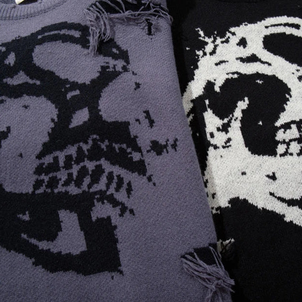 Two sweaters with skull designs, one in gray and black, the other in white and black.