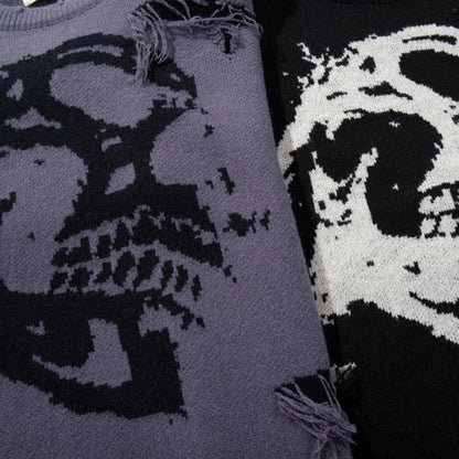 Two sweaters with skull designs, one in gray and black, the other in white and black.