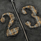 Plaid numbers '23' on a dark fabric background