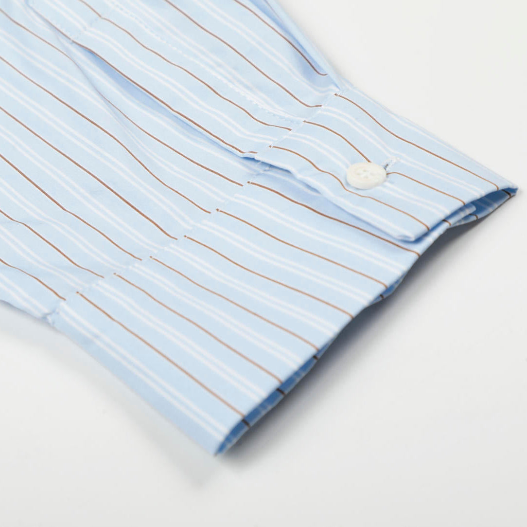Close-up of a light blue striped shirt with a collar on a white background