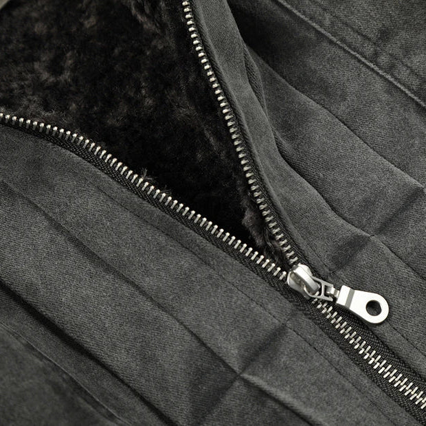 Close-up of a zipper on a dark jacket with a brand logo.