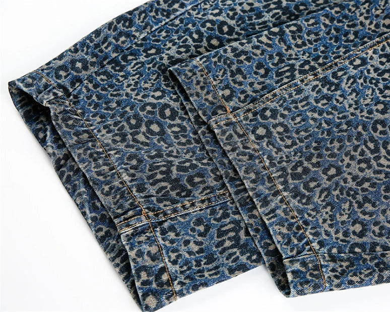 Blue denim jeans with a leopard print pattern on a white background