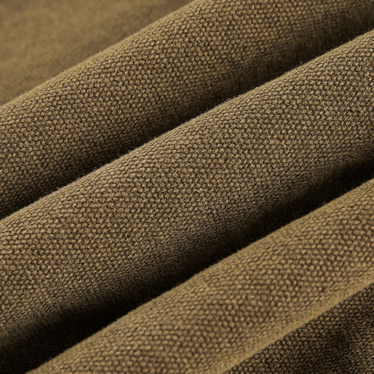 Close-up of brown fabric with a textured pattern ofthe Buckle Collar Utility Jacket from h0neybear aka honeybear