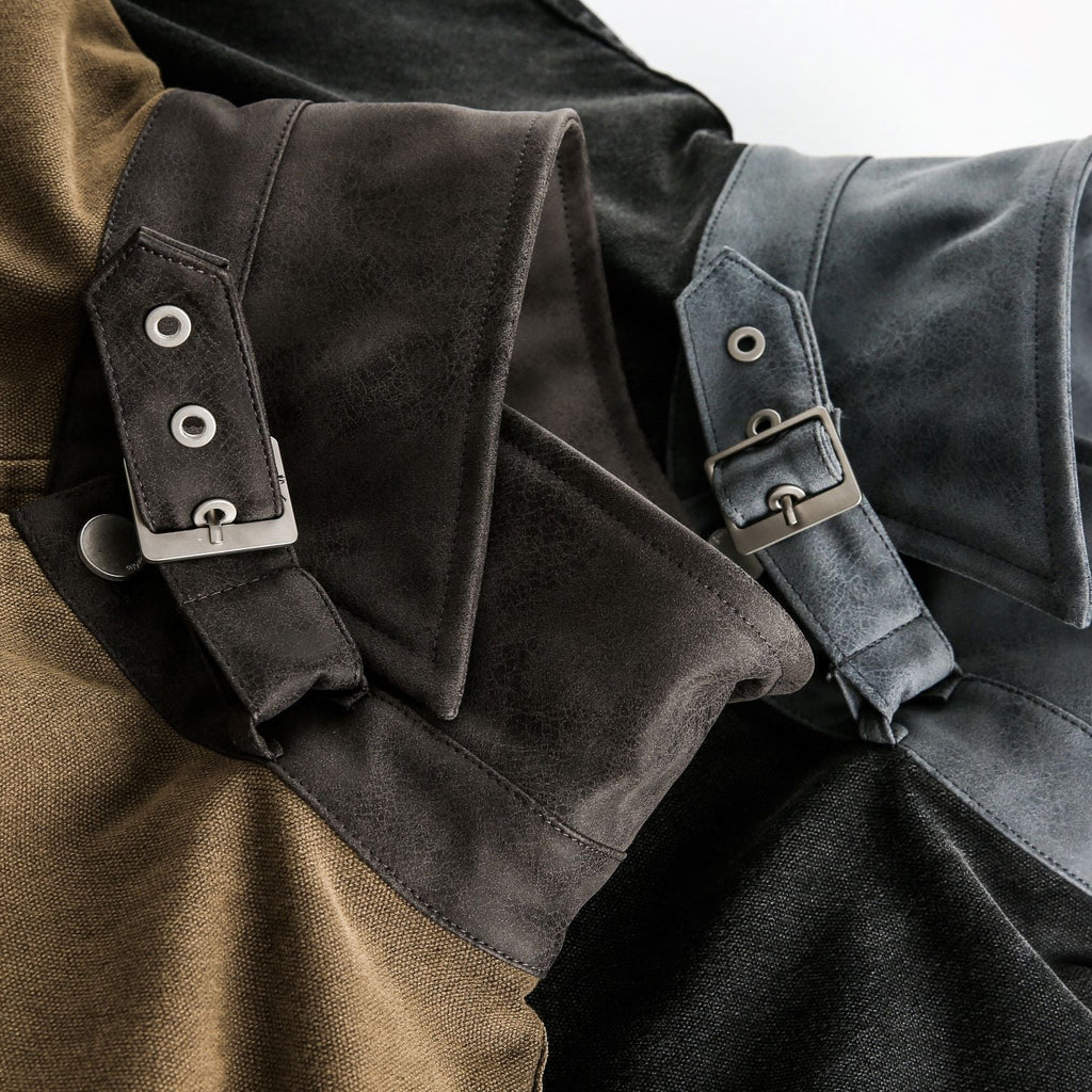 Close-up of a jacket with leather straps and buckles on a white background Buckle Collar Utility Jacket from h0neybear aka honeybear clothing