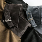 Close-up of a jacket with leather straps and buckles on a white background Buckle Collar Utility Jacket from h0neybear aka honeybear clothing