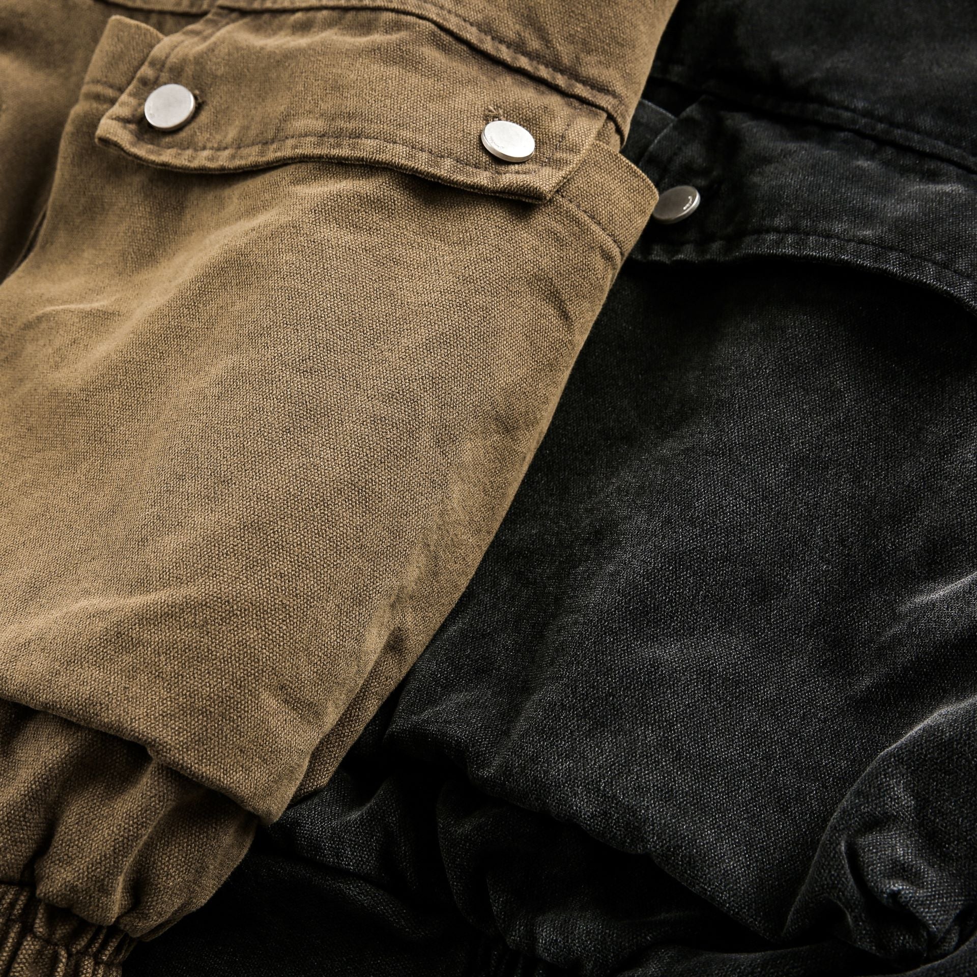 Close-up of brown and black fabric with buttons on a white background Buckle Collar Utility Jacket from h0neybear aka honeybear clothing