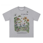 Gray t-shirt with fairy and floral design on a white background