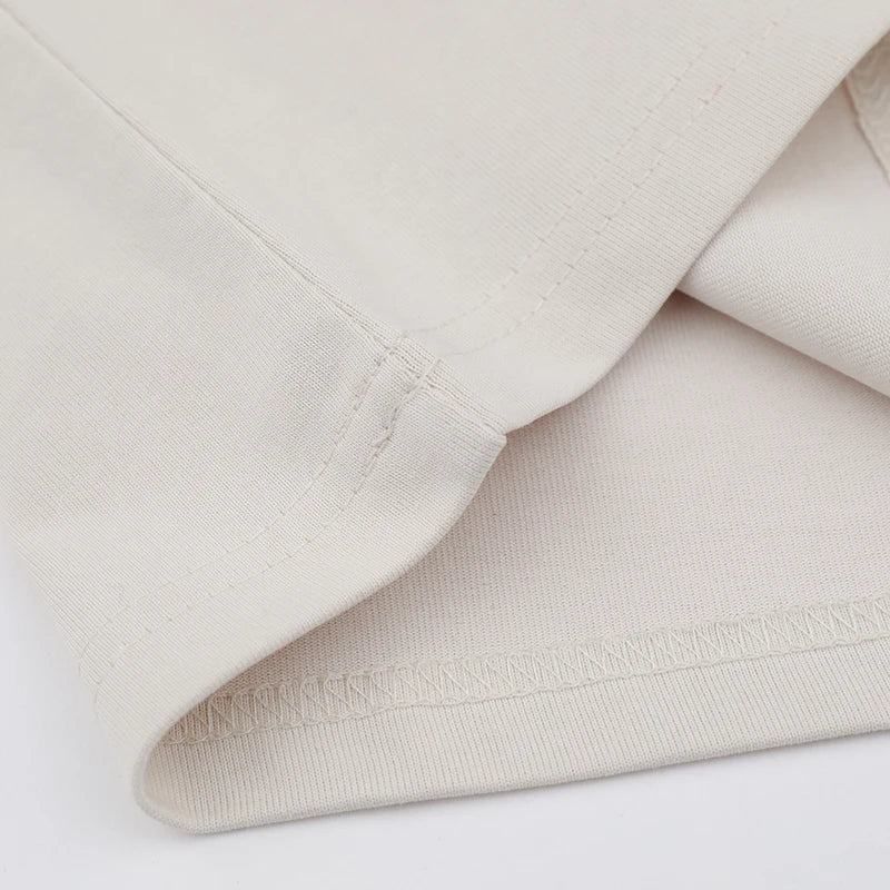 Close-up of beige fabric with a white background